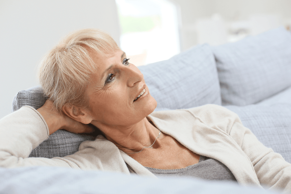 Senior woman relaxing on sofa