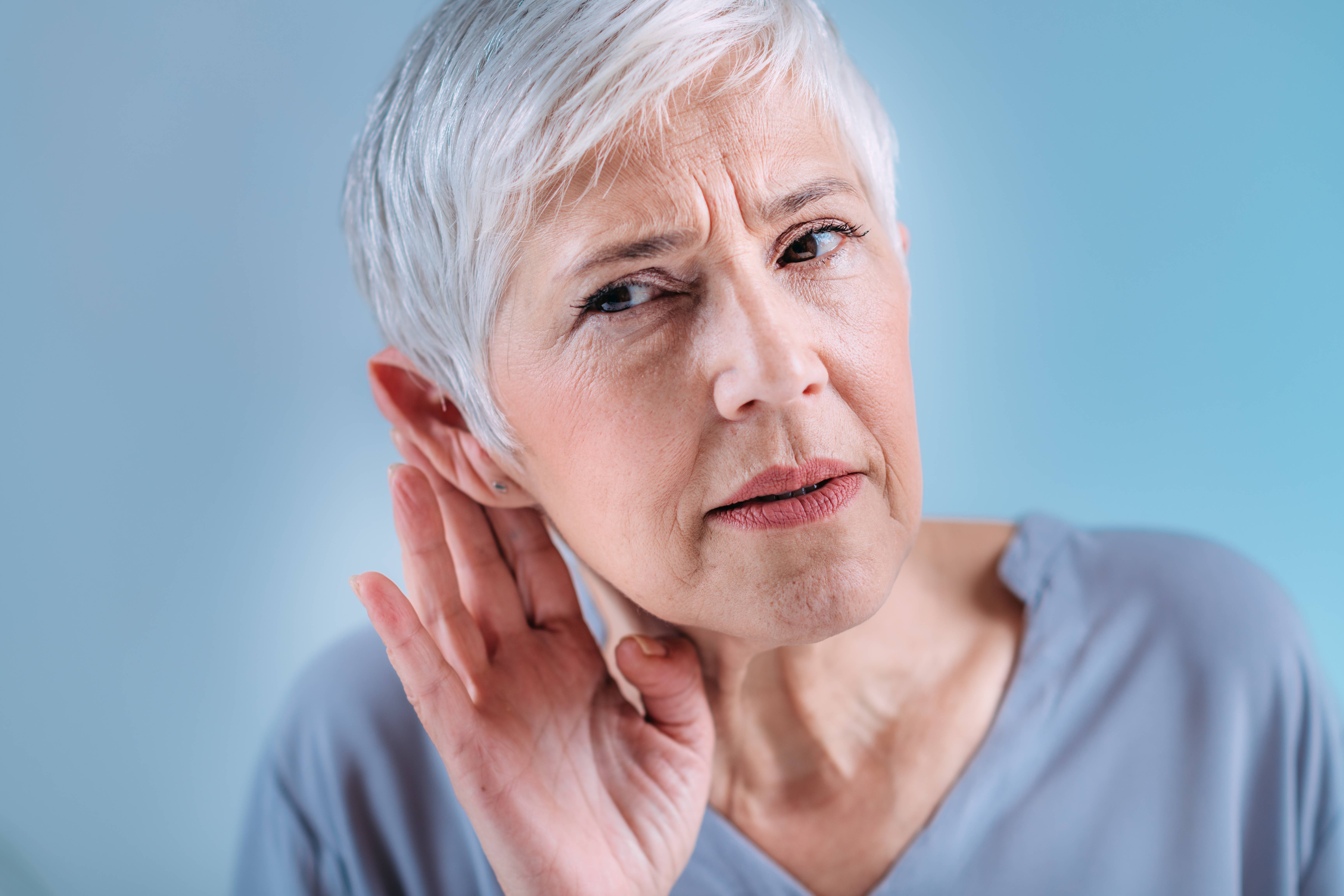 Hearing loss. Senior woman 