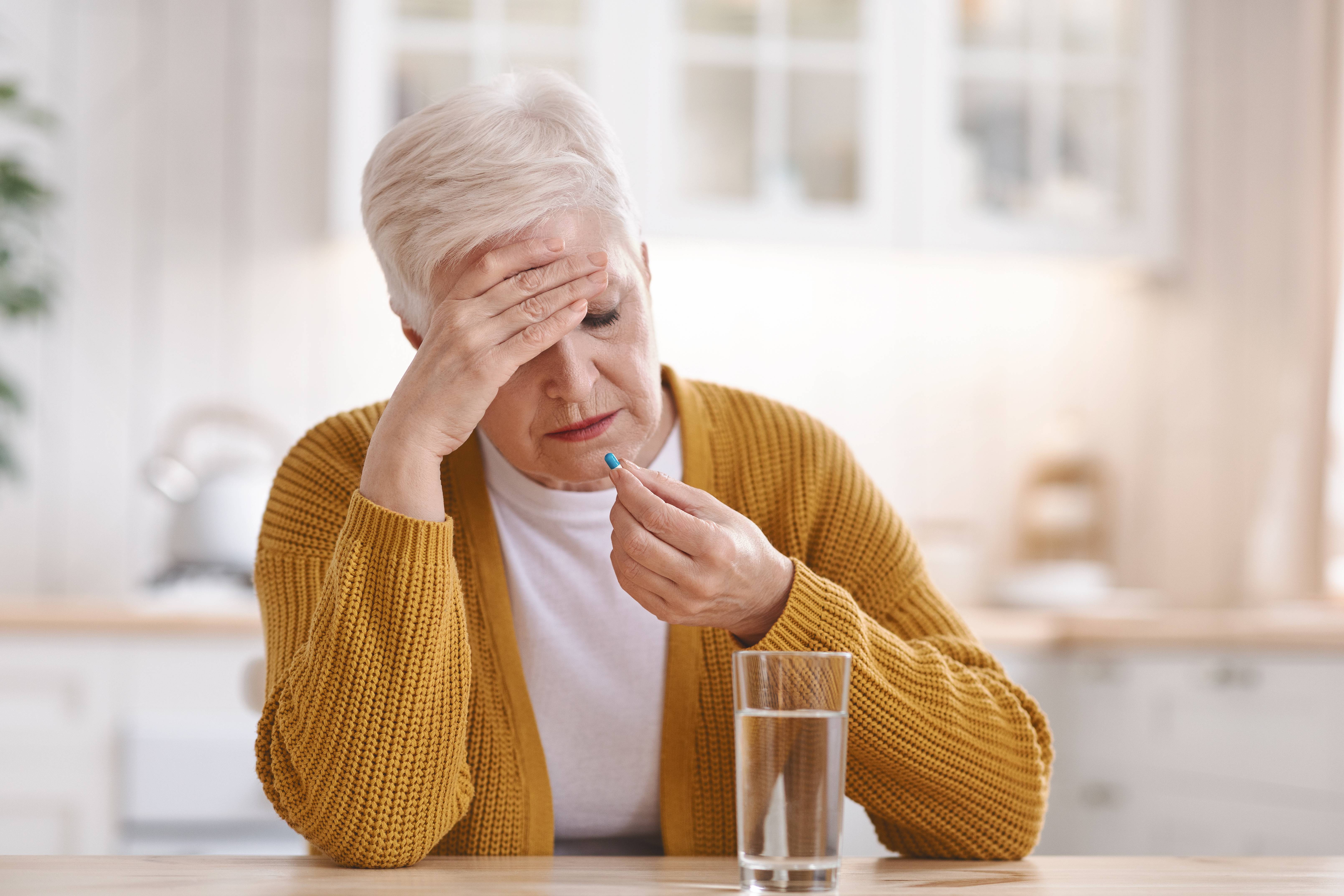 Old woman suffering from headache